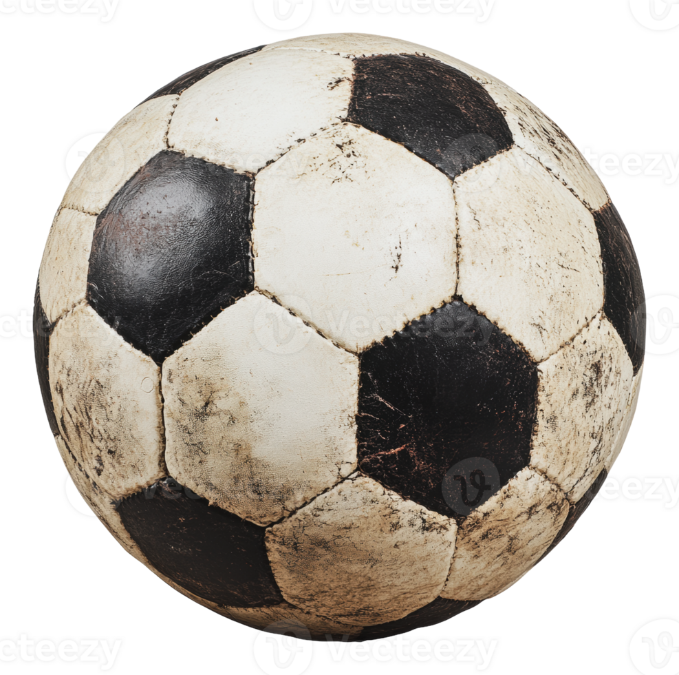 Worn soccer ball resting on a grassy field at dusk png