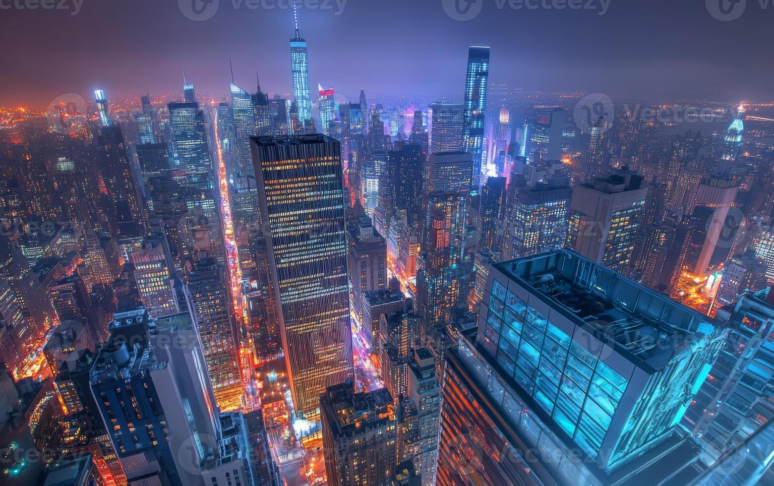 A rooftop view of a city at night, skyscrapers and busy streets far below, glowing lights photo