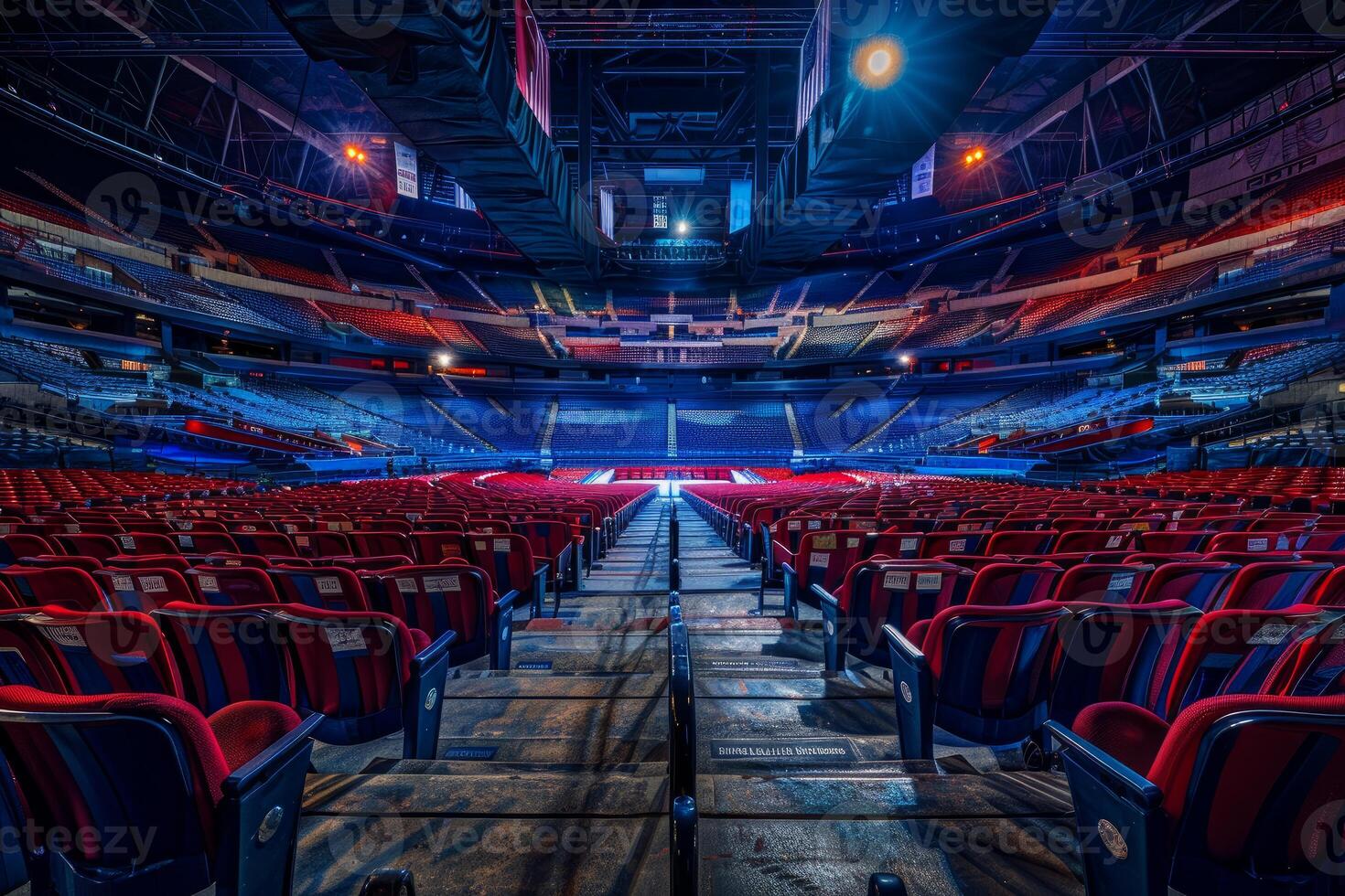 Empty sports arena with red seats and stage lighting awaiting a big event photo