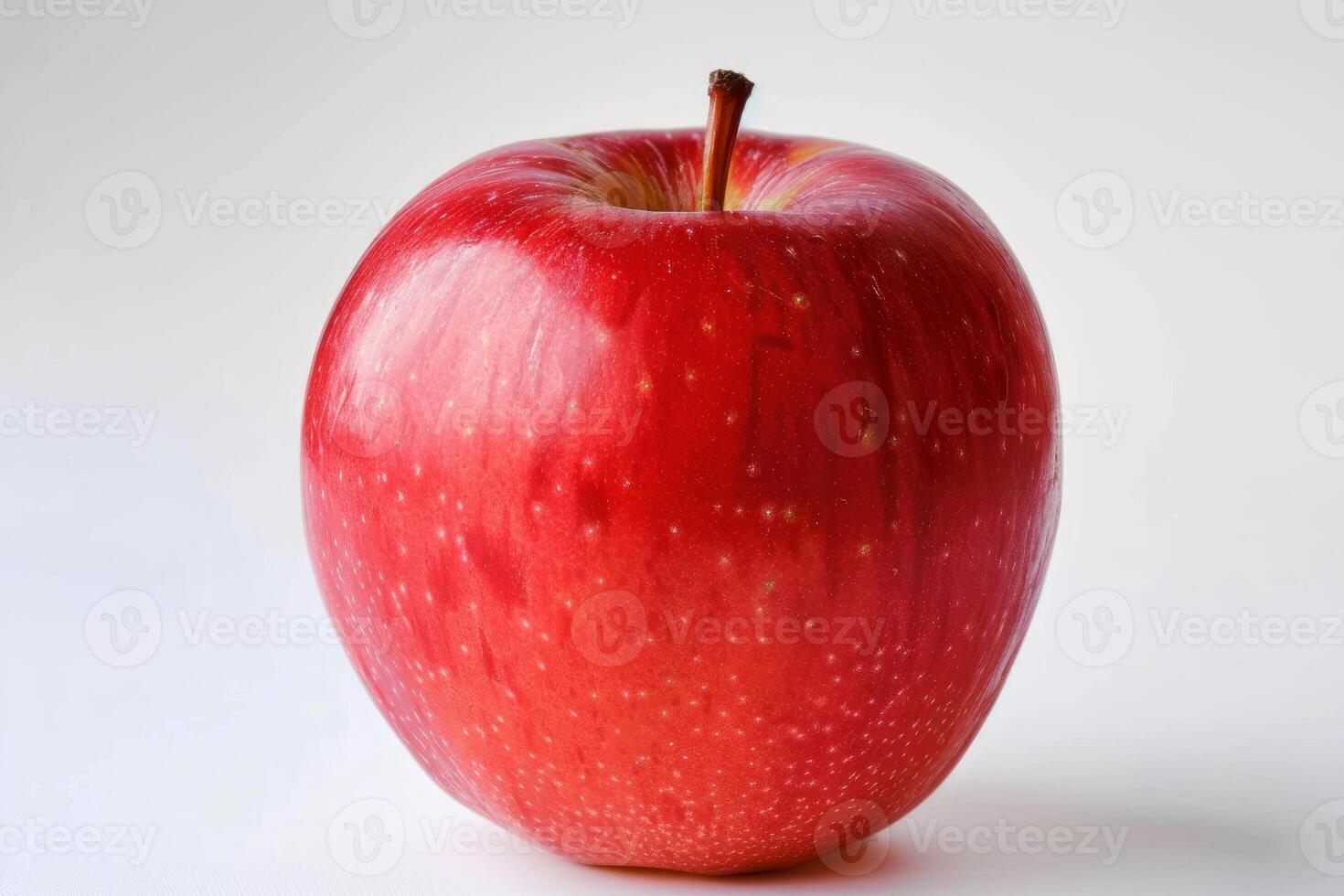 Shiny red apple standing on white background photo