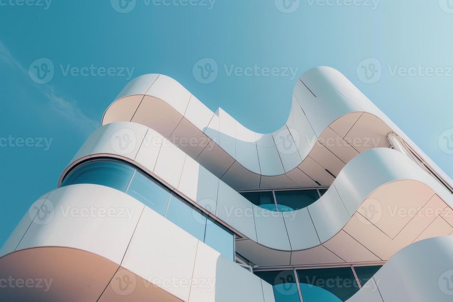 Modern office building with curved walls on a sunny day photo