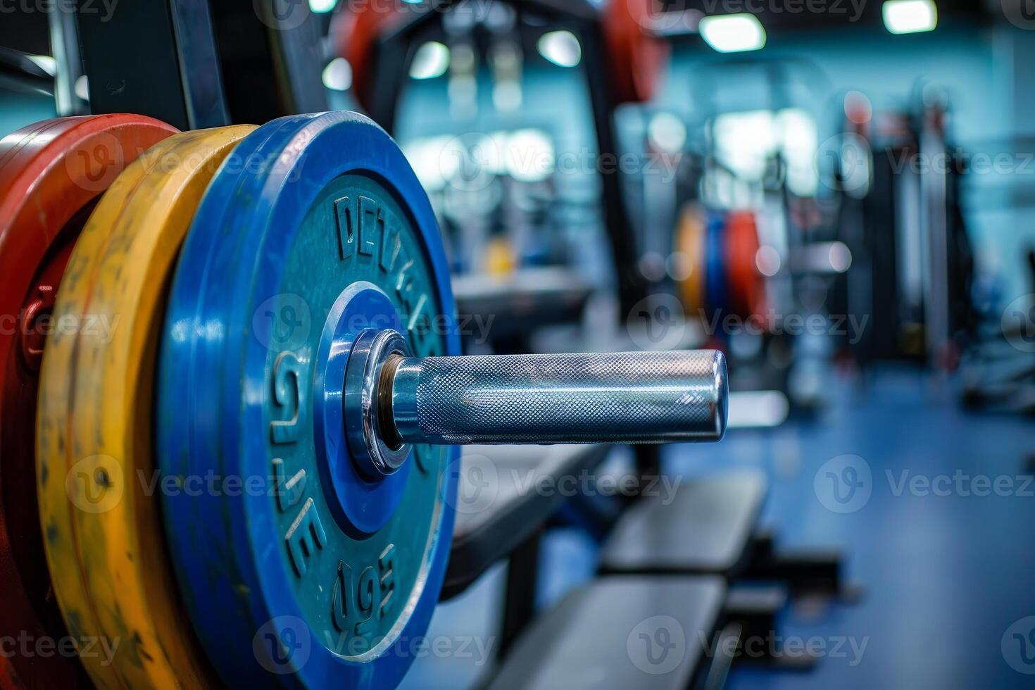 Close up of barbell waiting for weightlifter in gym photo