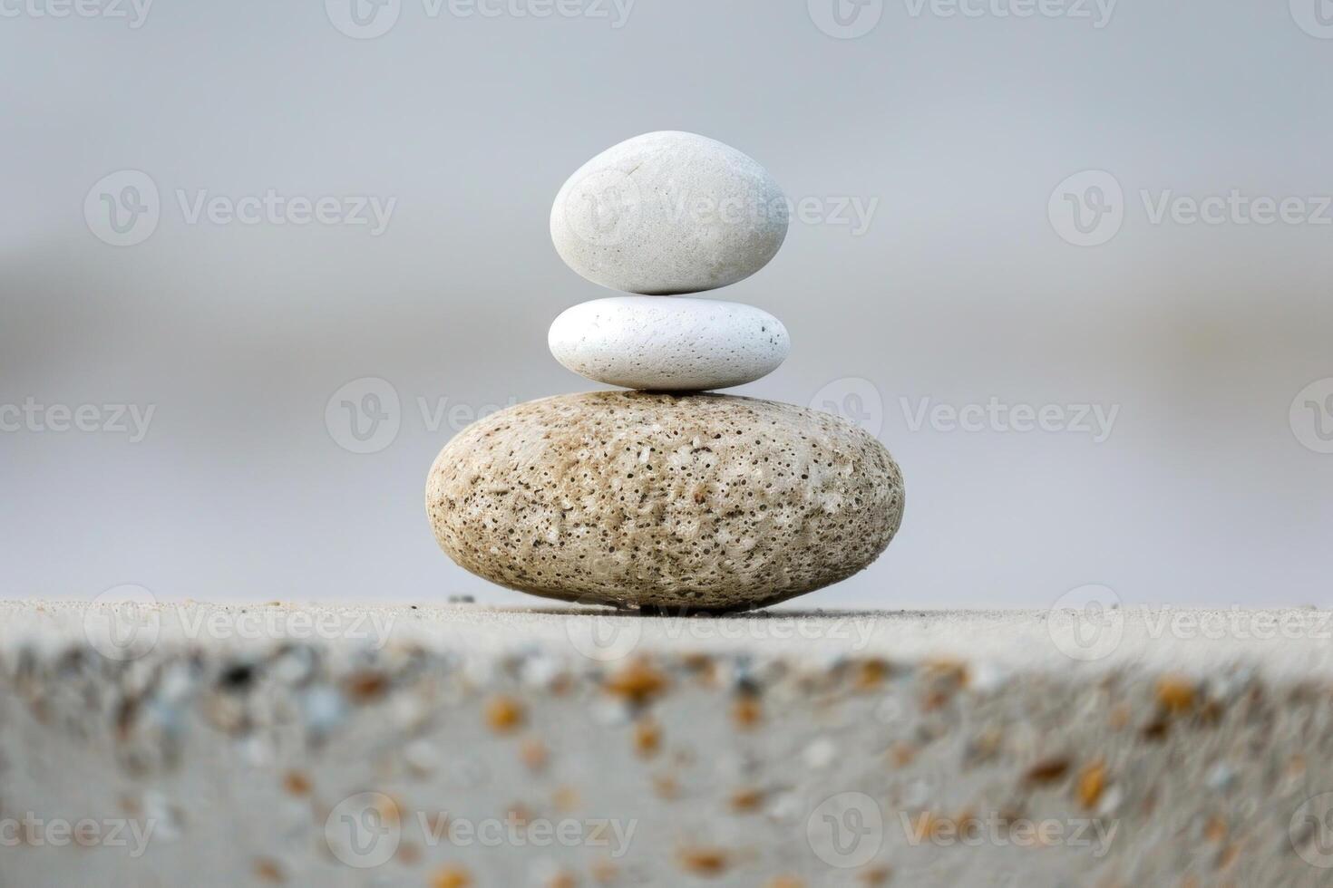 Stack of white and grey balancing stones on top of each other photo