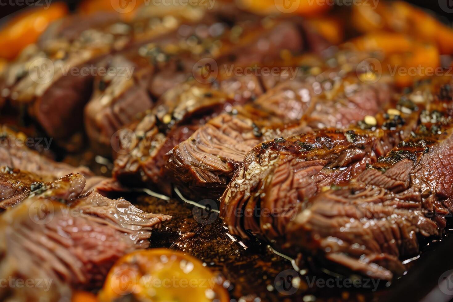 Sliced beef tenderloin roast with herbs and spices resting on a baking sheet photo