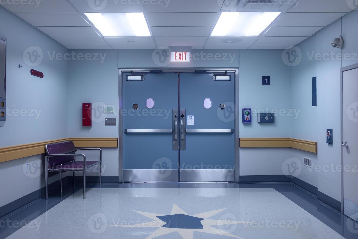 Empty hospital hallway with exit sign over double doors photo