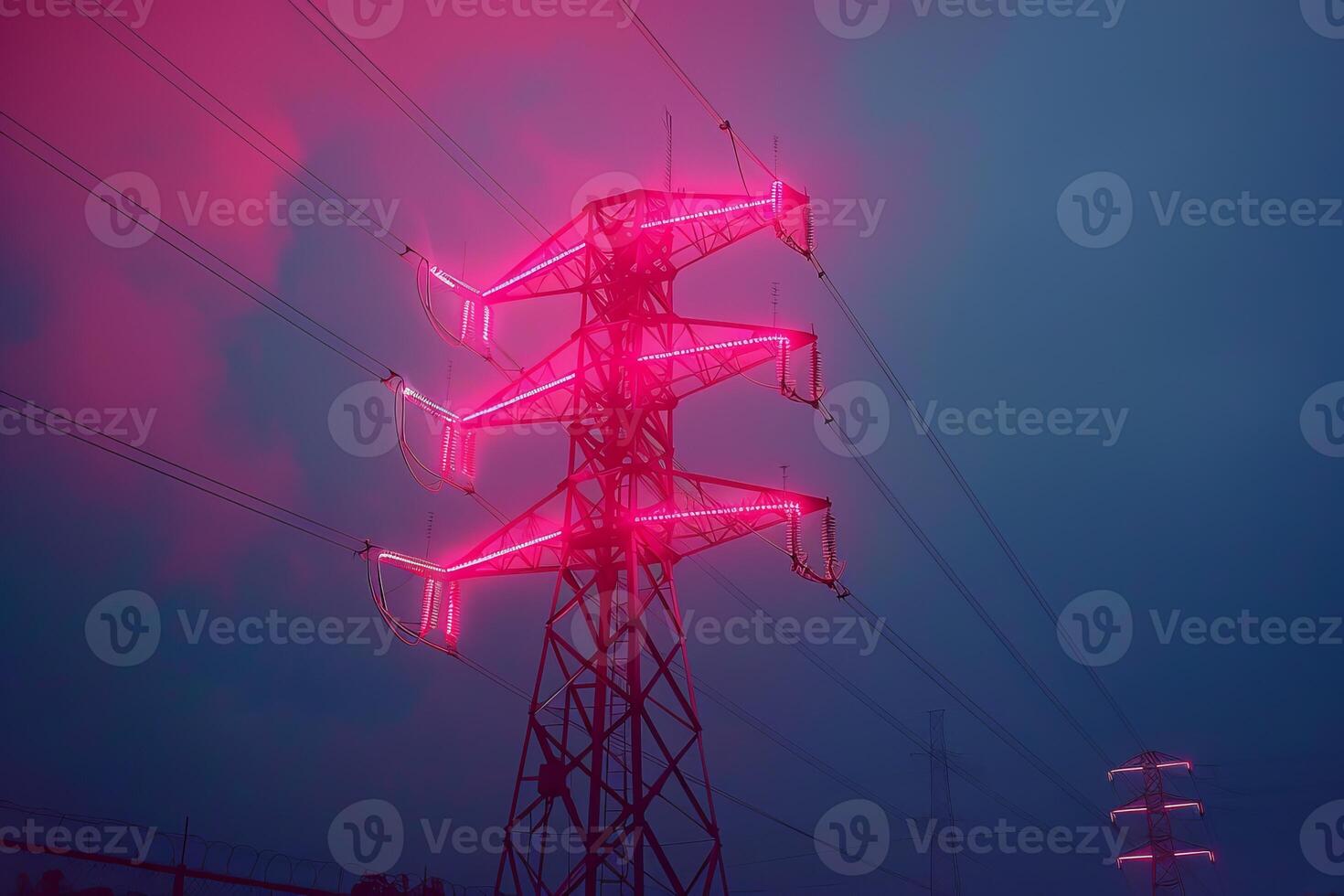 High voltage power lines glowing at dusk photo