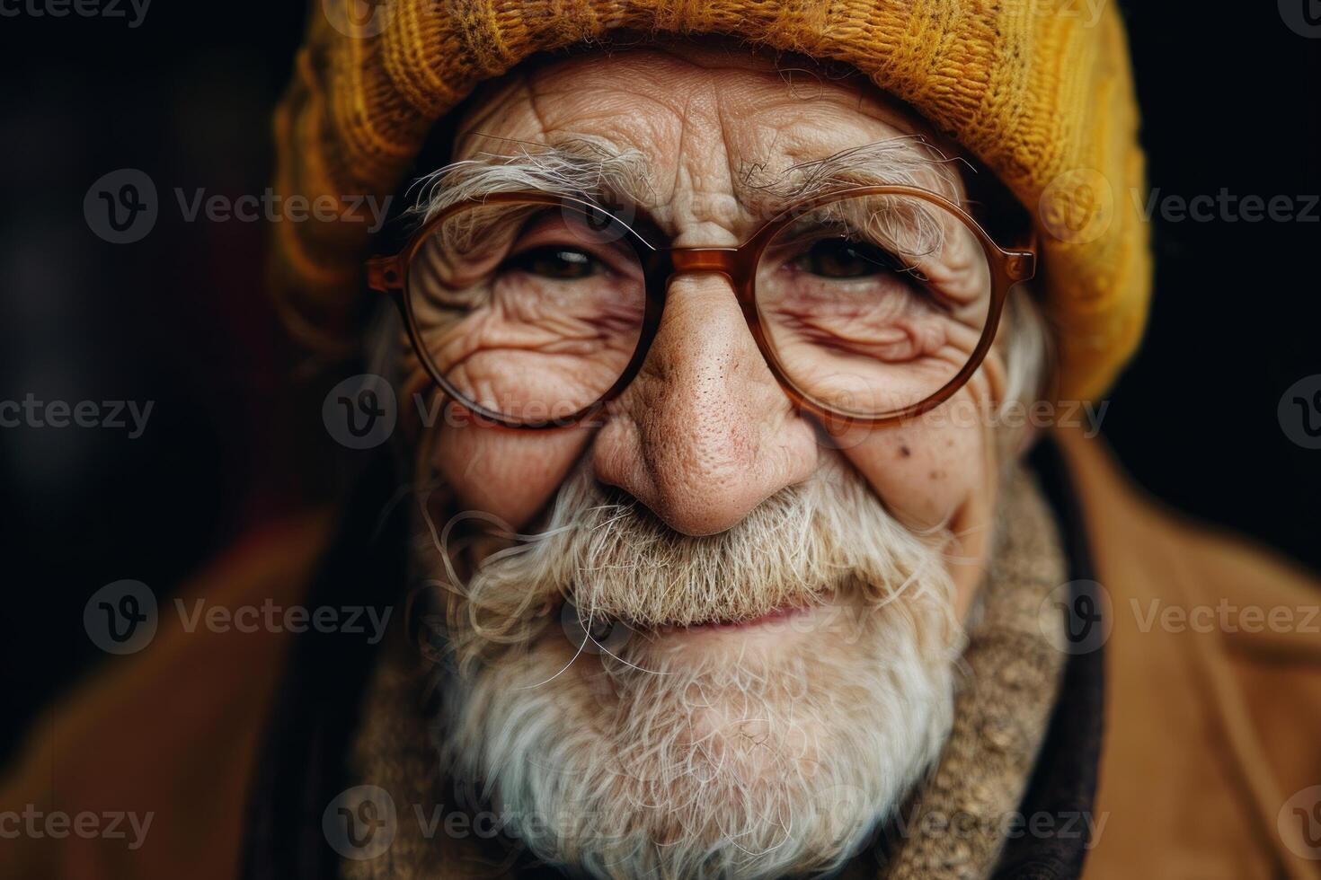 Portrait of smiling senior man wearing yellow beanie and glasses photo