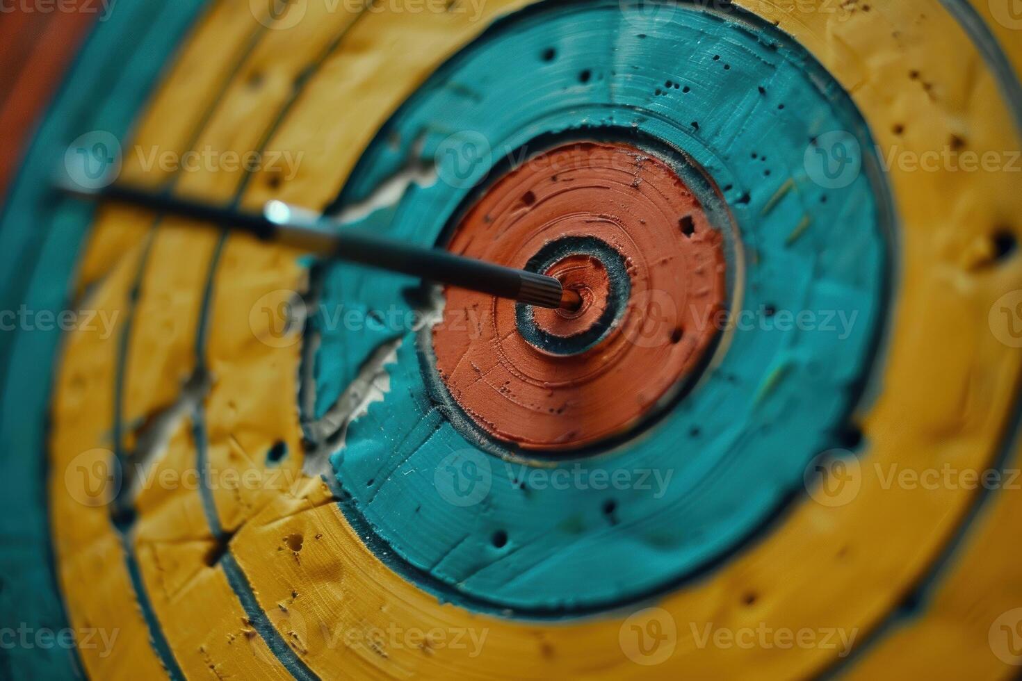 Arrow hitting the center of an archery target photo