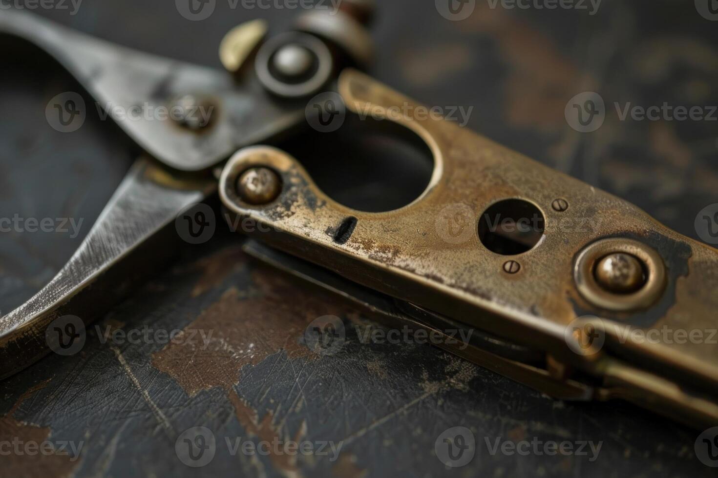Old rusty caliper lying on a metal workbench photo