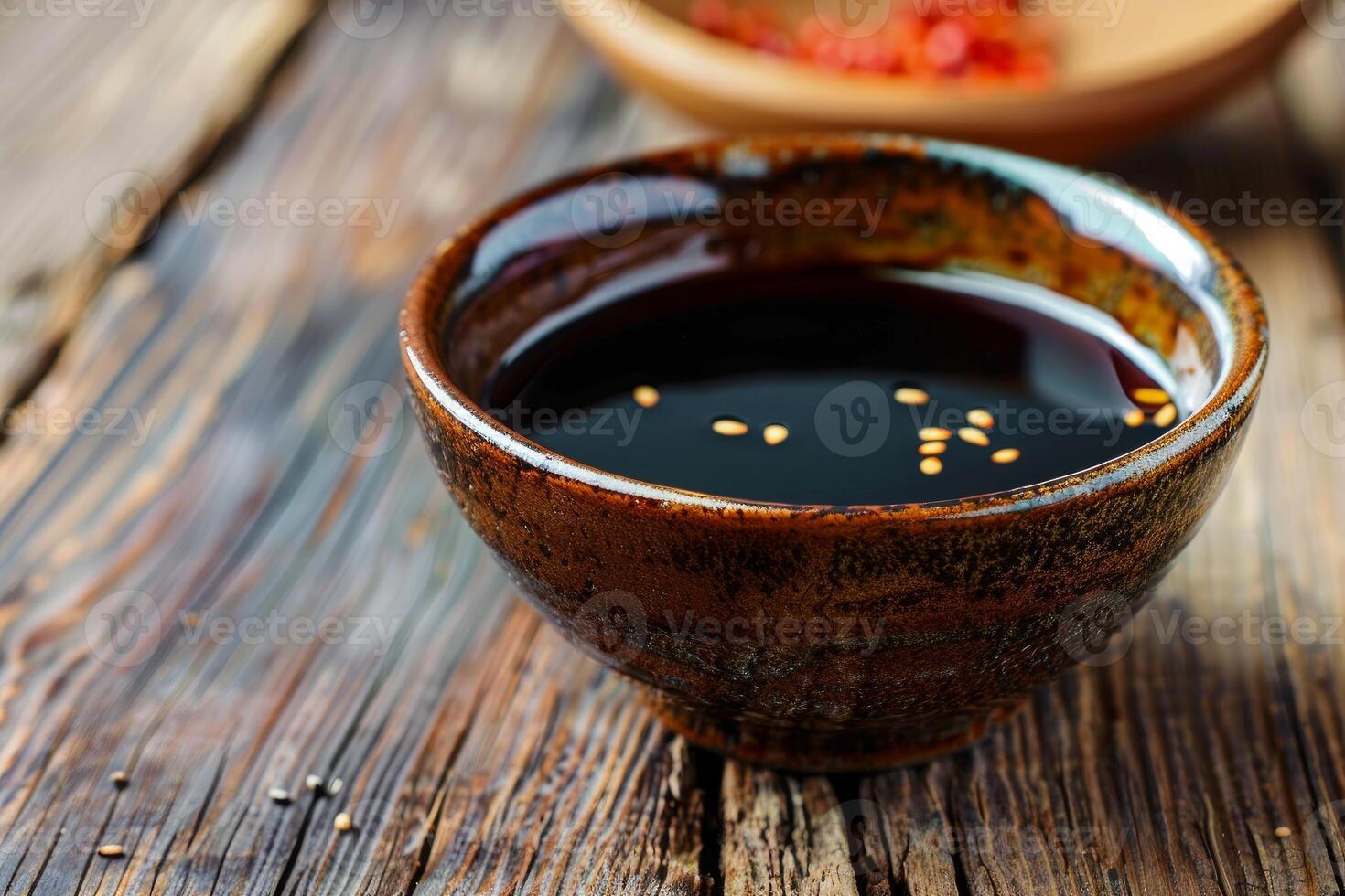 Rustic bowl overflowing with savory soy sauce on wooden table photo