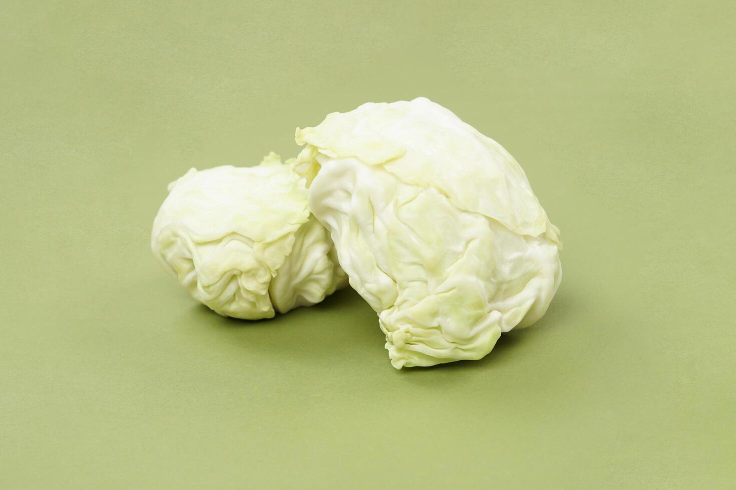 green cabbage isolated on a green background photo