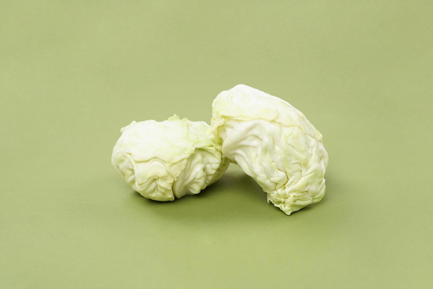 green cabbage isolated on a green background photo