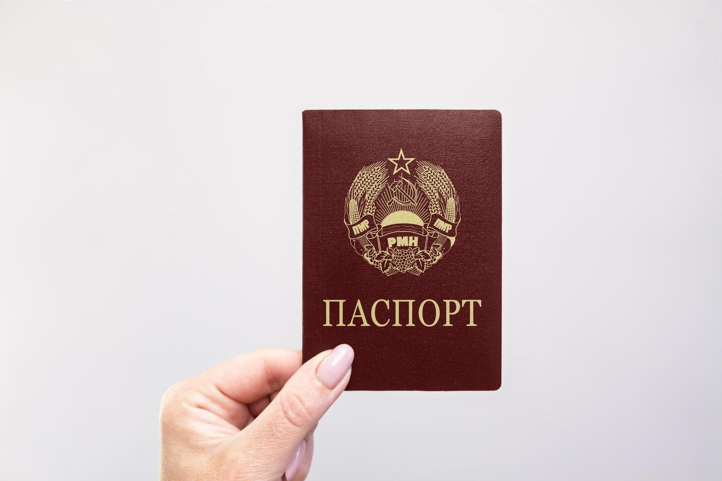 Transnitria Passport Held Against Simple White Background. Astana, Kazakhstan, 26 october 2024 photo