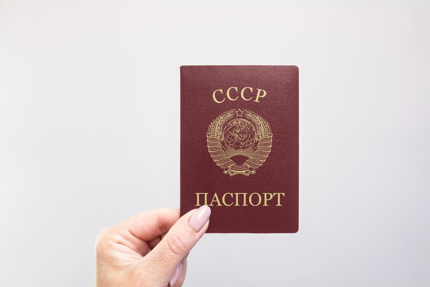 Soviet Union Passport Held Against Simple White Background. Astana, Kazakhstan, 26 october 2024 photo