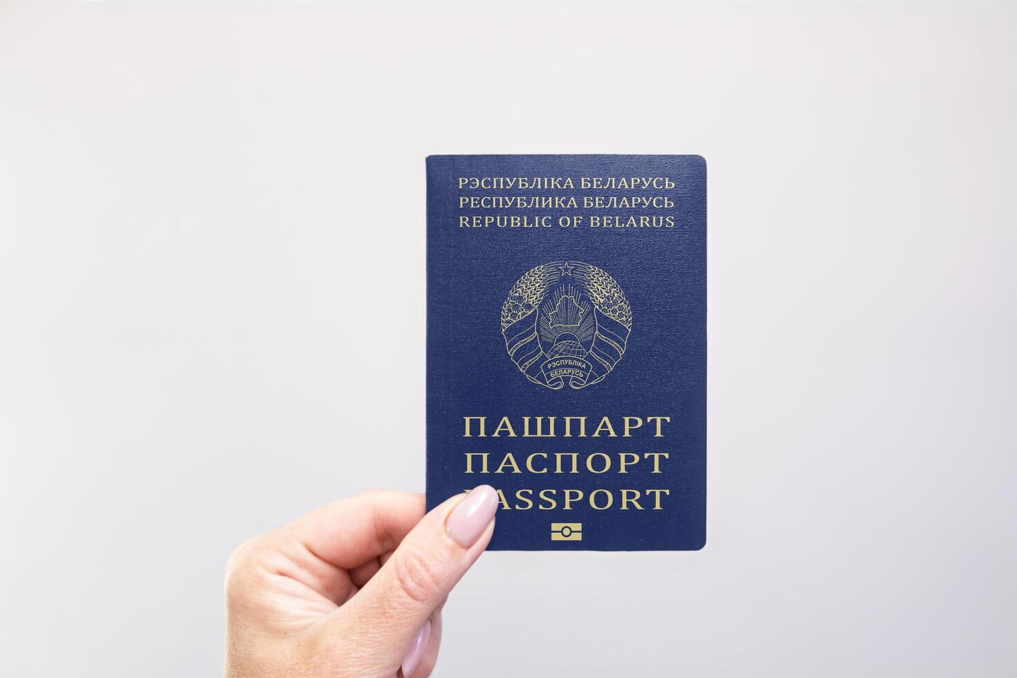 Belarus Passport Held Against Simple White Background. Astana, Kazakhstan, 26 october 2024 photo