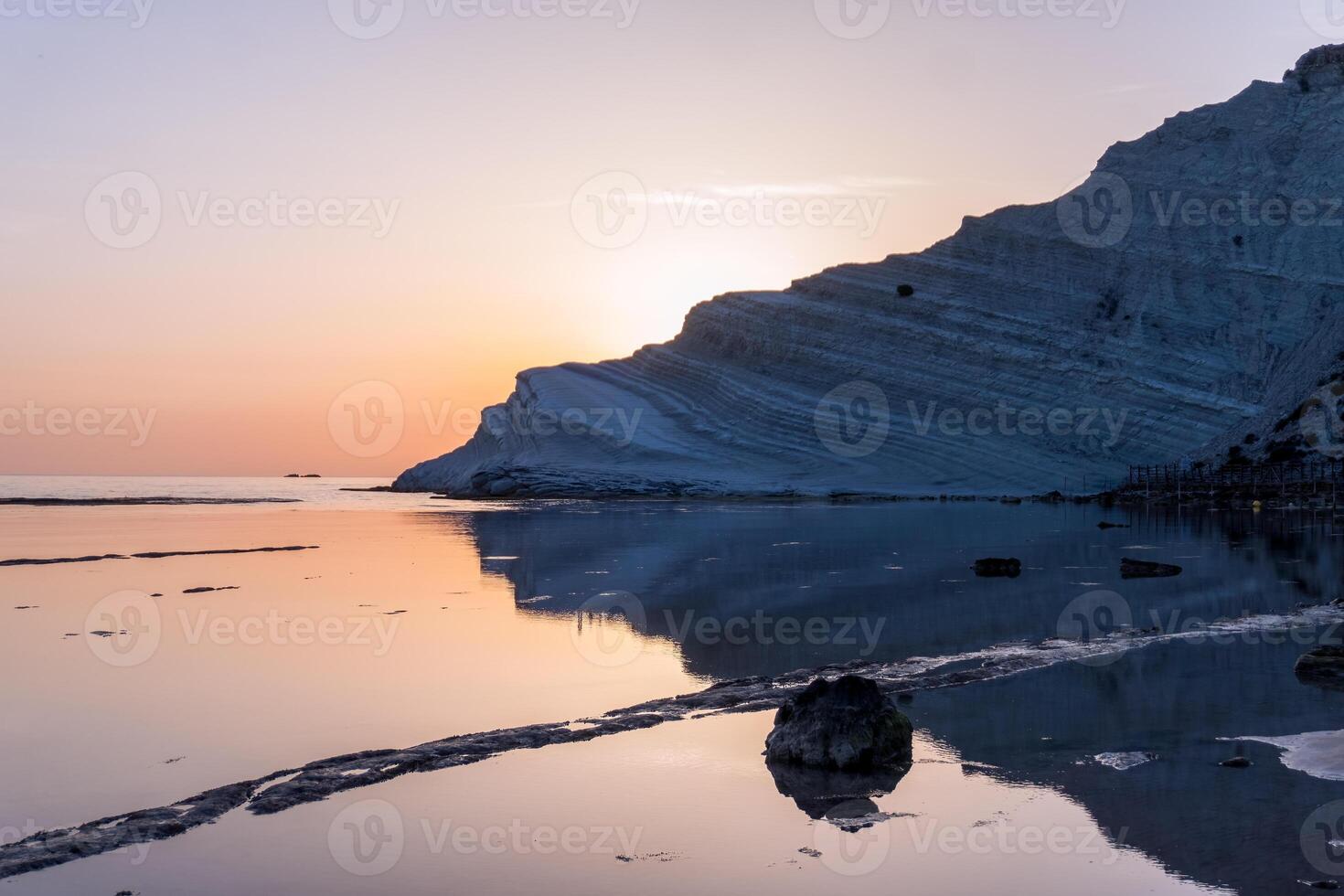 Sicily, Italy-May 10, 2022-the beach in Sicily near the Turkish scale during a sunset photo