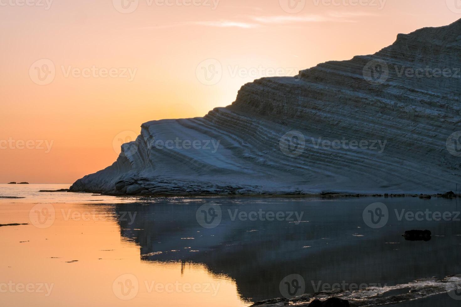 Sicily, Italy-May 10, 2022-the beach in Sicily near the Turkish scale during a sunset photo