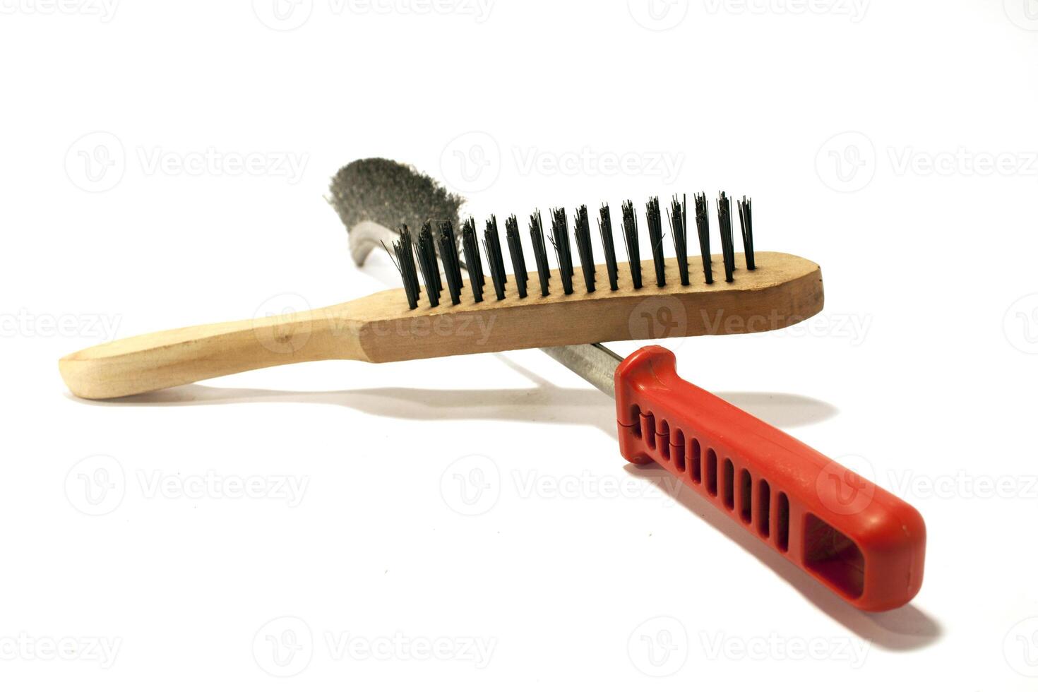 A brush and a comb on a white surface photo