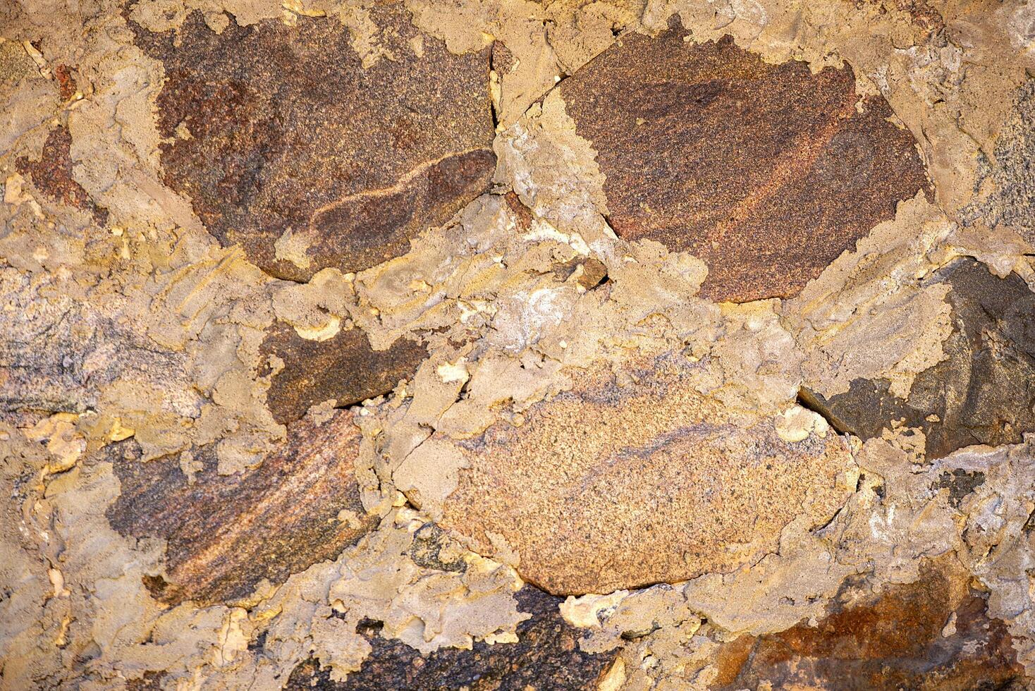 Stone background, rock wall backdrop with rough texture. Abstract, grungy and textured surface of stone material. Nature detail of rocks. photo