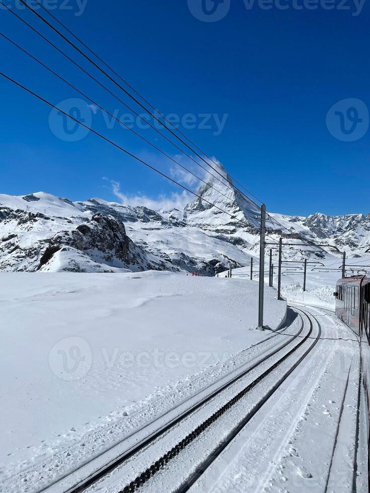 Stunning view of the Matterhorn peak on the train and glacier in Zermatt. photo