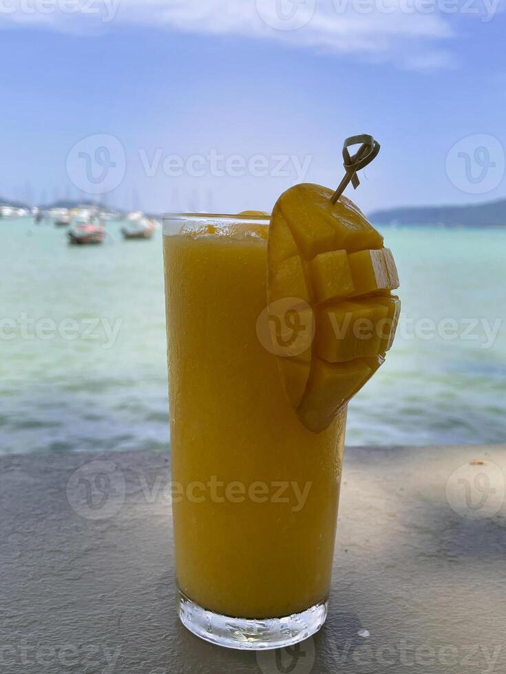 Mango smoothie in summer, Andaman sea. photo