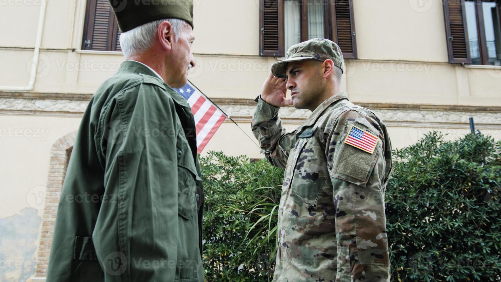 General Instills Valor In American Serviceman With Flag For His Service photo