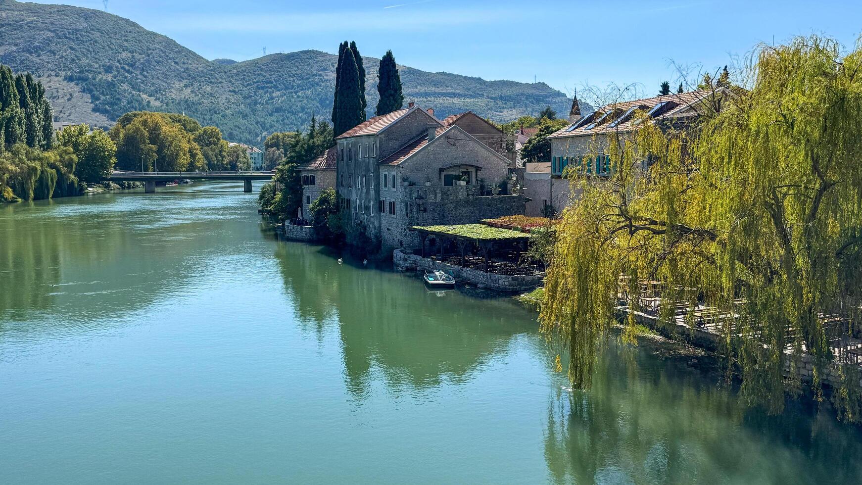 the Trebisnica River and the old town. Trebinje, Bosnia and Herzegovina, 2 October 2024 photo