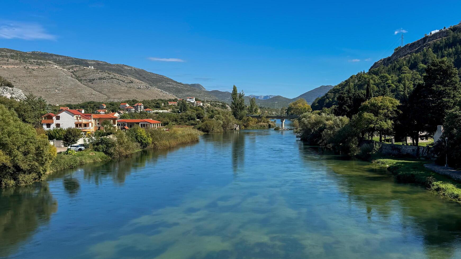 View from the bridge to the Trebisnica River. Trebinje, Bosnia and Herzegovina, 2 October 2024 photo