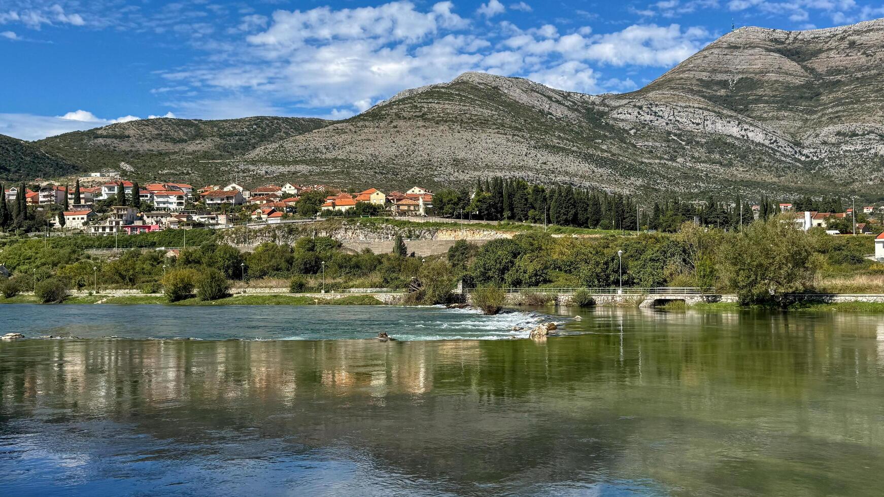 Cityscape from the Trebisnjica River.Trebinje, Bosnia and Herzegovina,October 2, 2024 photo