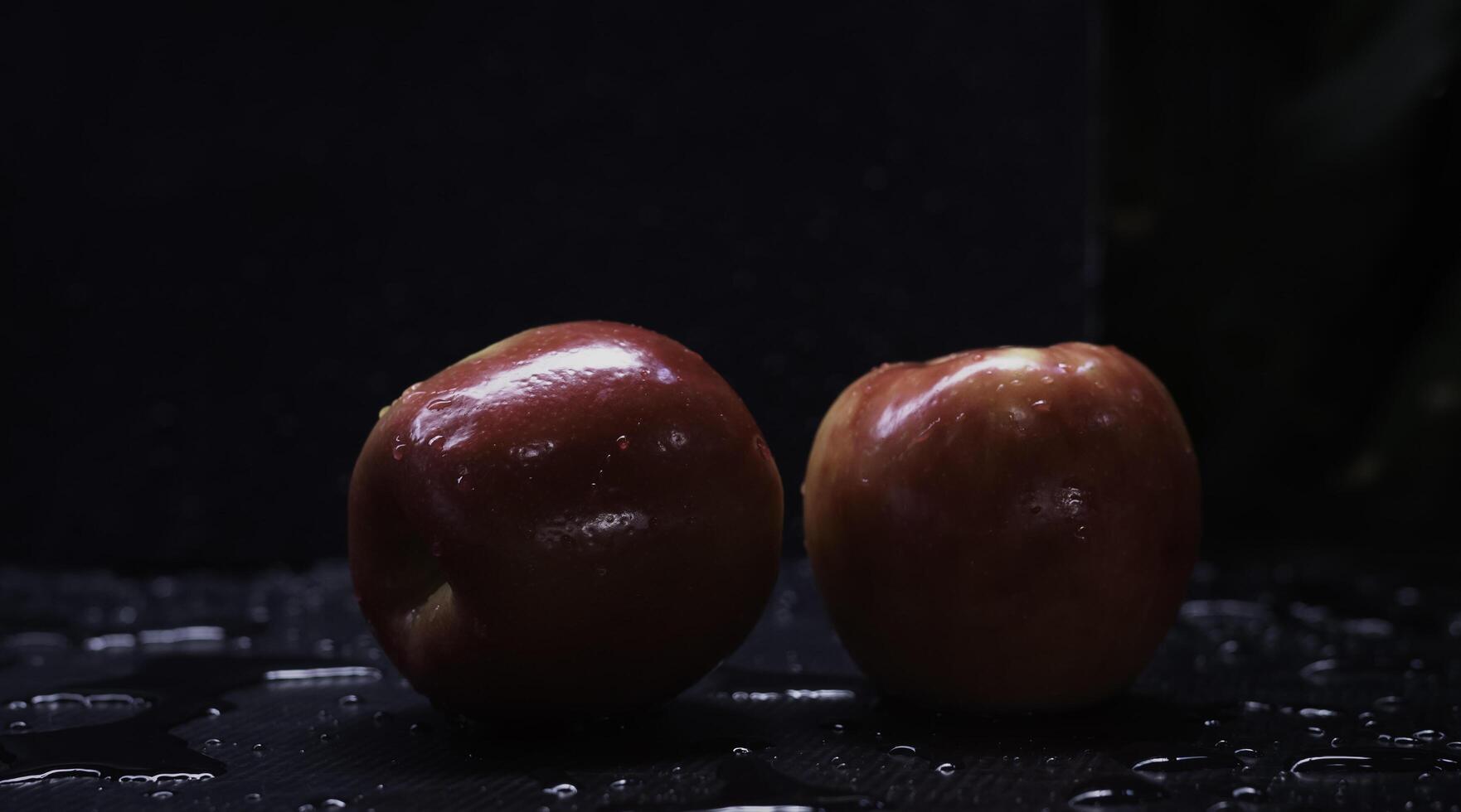 Two red apples with shiny peel form paraffin coating photo
