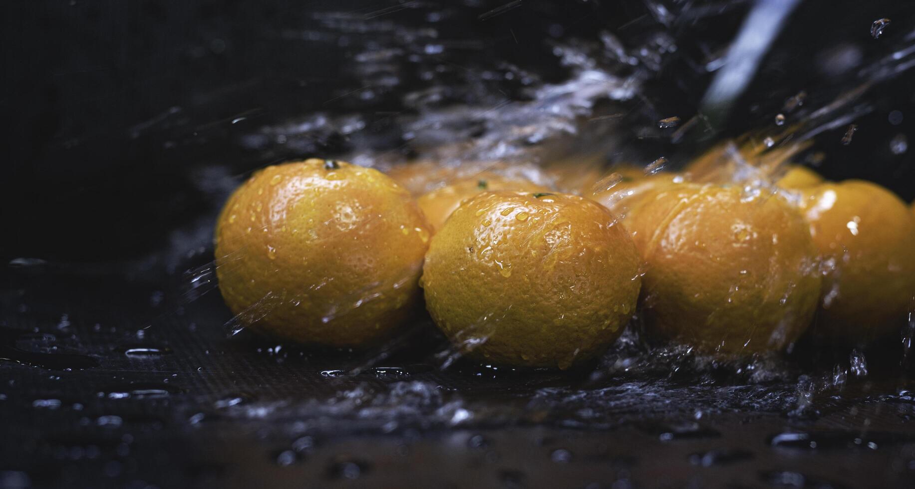 Orange fruit was wet with water splash, photo