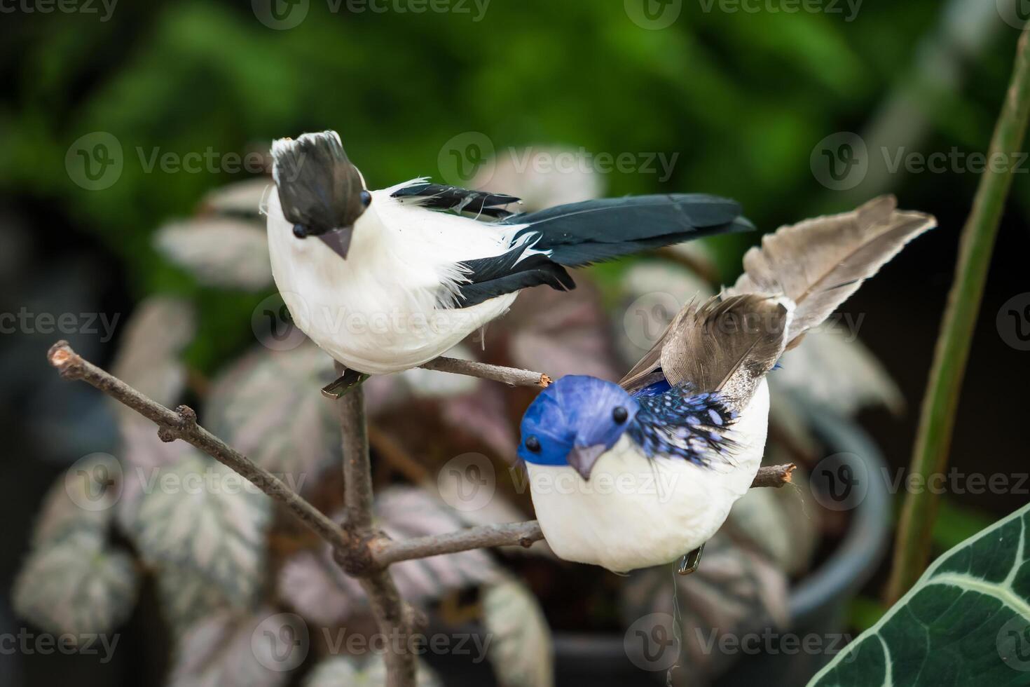 Artificial Bird on Branch.Elegant Accent for Flower Arrangements and Garden Decorations photo