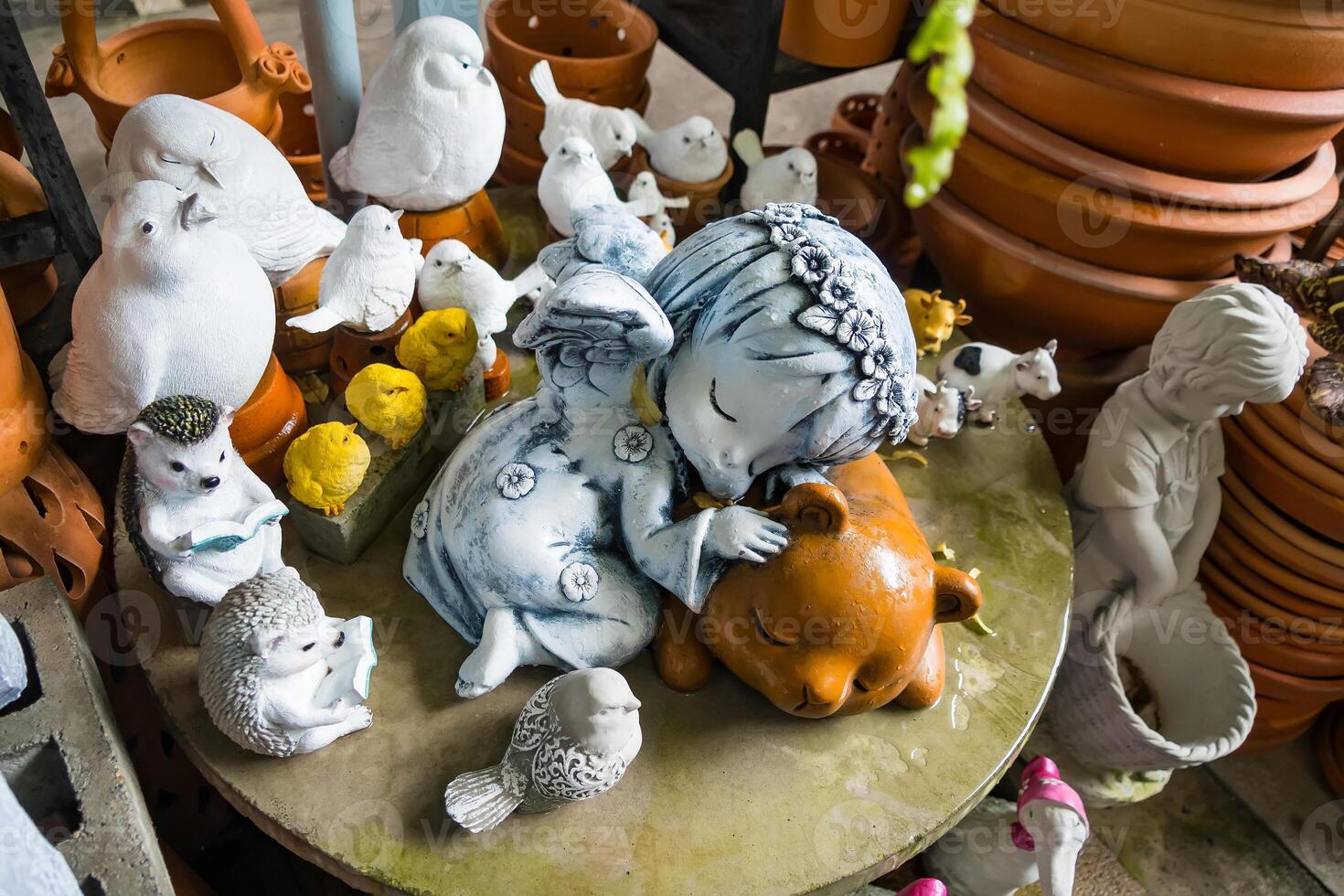 Nonthaburi, Thailand - July, 11, 2024 - Charming Garden Decor Cement Figurines Shop with a Variety of Decorative Statues for Flower Gardens at Nonthaburi, Thailand photo