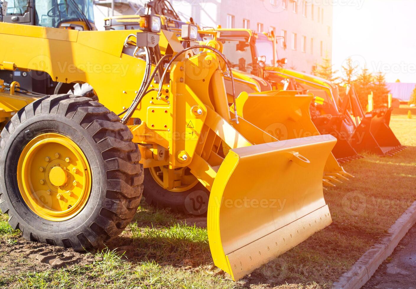 new modern grader for planning and moving soil. Road construction and leveling, industry photo