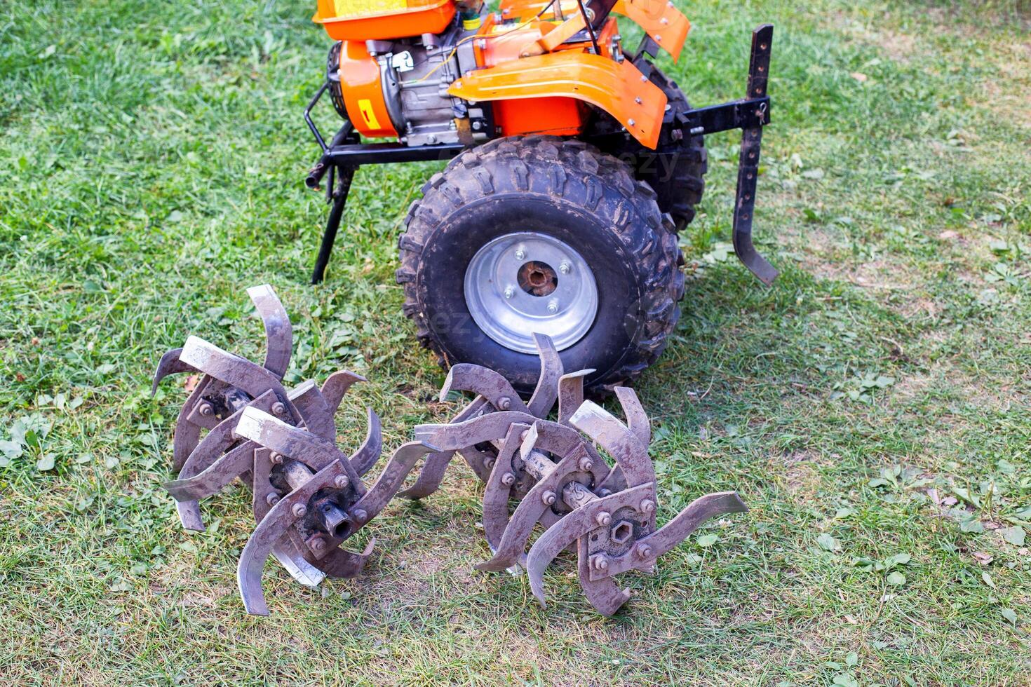 cutters complete with walk-behind tractor for work on the ground. Technique for agriculture. Motor cultivator photo