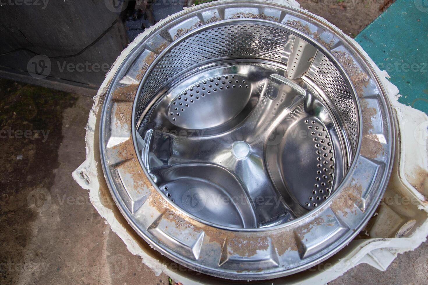 Disassembling the washing machine drum to replace the cross. Washing machine breakdown and repair, close-up photo