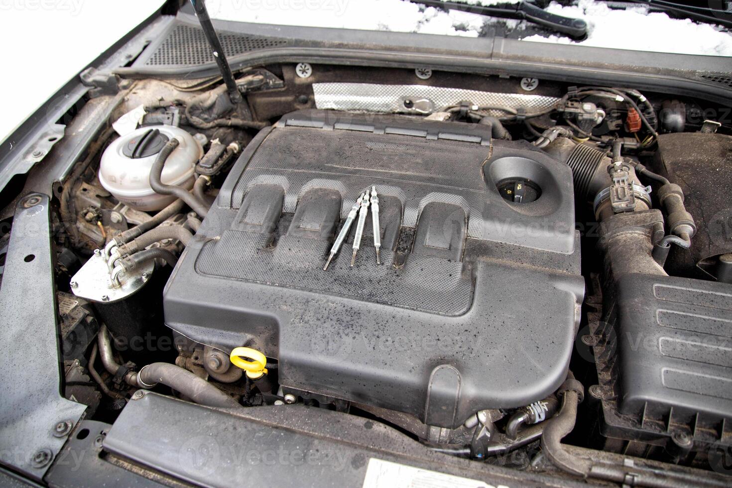 Modern ceramic glow plugs for diesel engines in cold weather in winter. Concept of breakdown and replacement of the heating element. Diesel engine preheater, industry photo