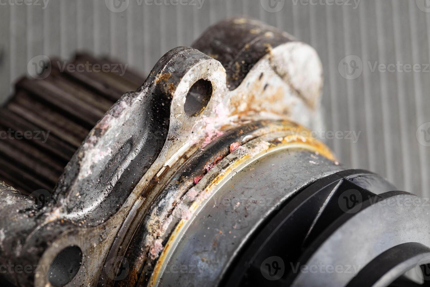 Old leaky car pump. Breakdown of the car pump in the cooling system, macro photo