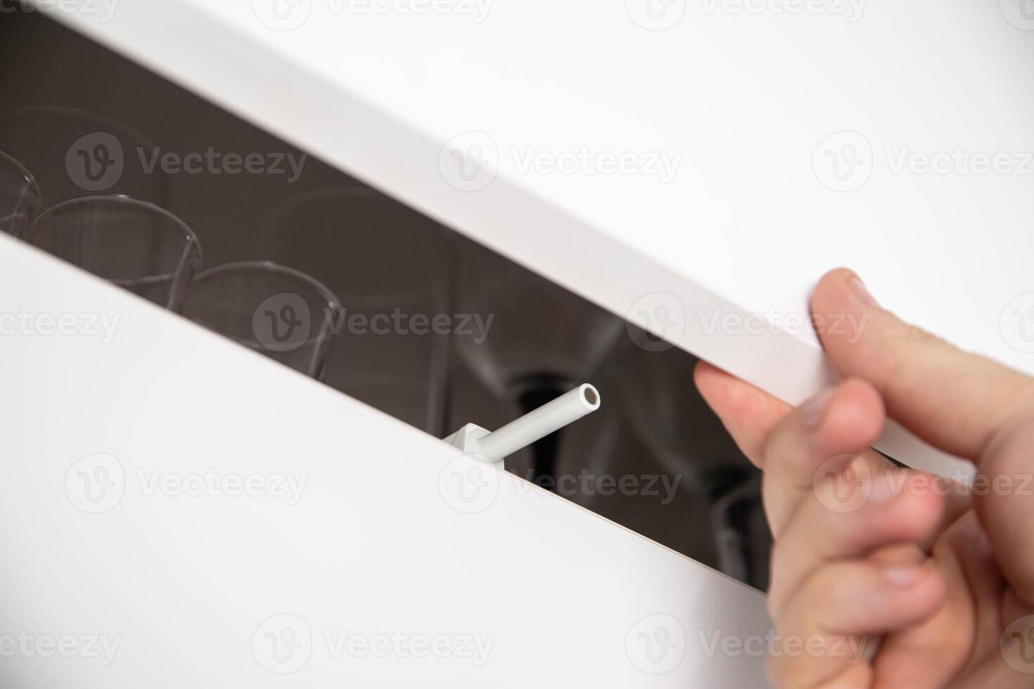 Modern push to open mechanism with magnetic tip, macro photo