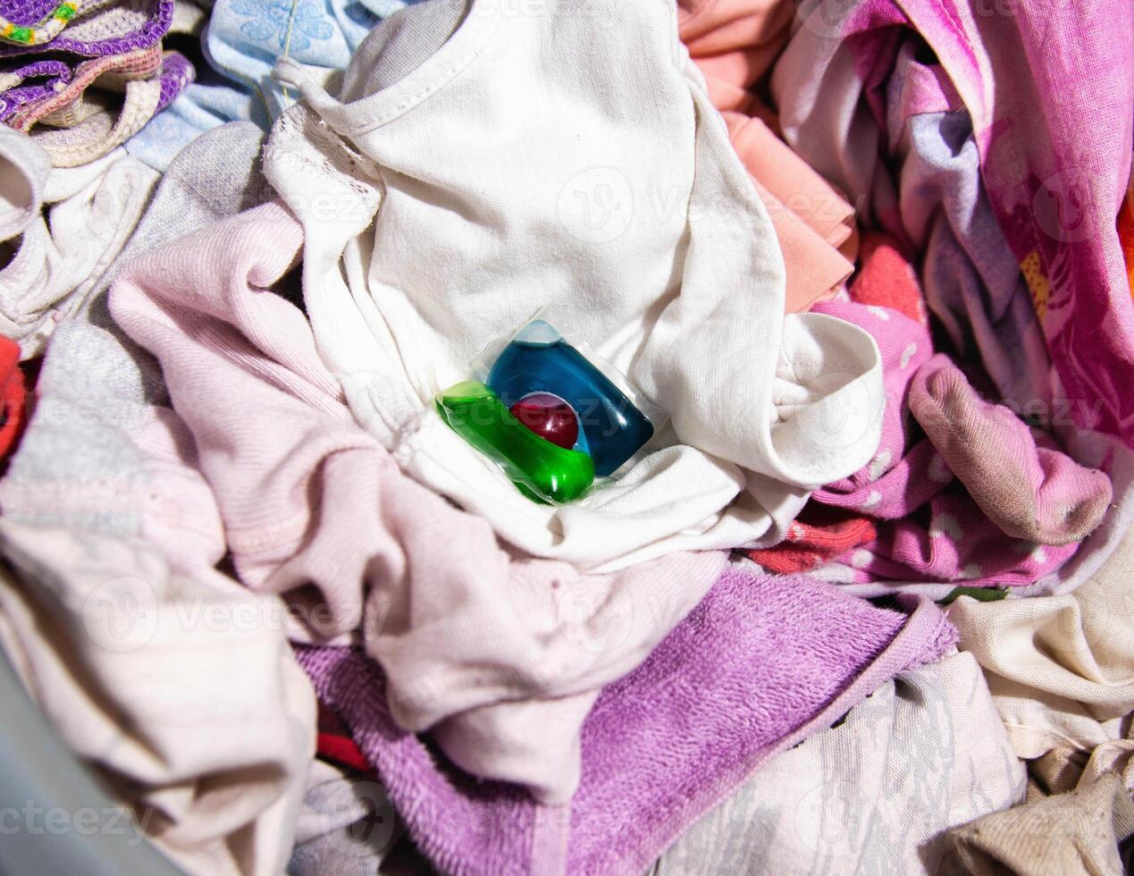 Modern multi-colored capsule for washing clothes in a washing machine. Close-up photo