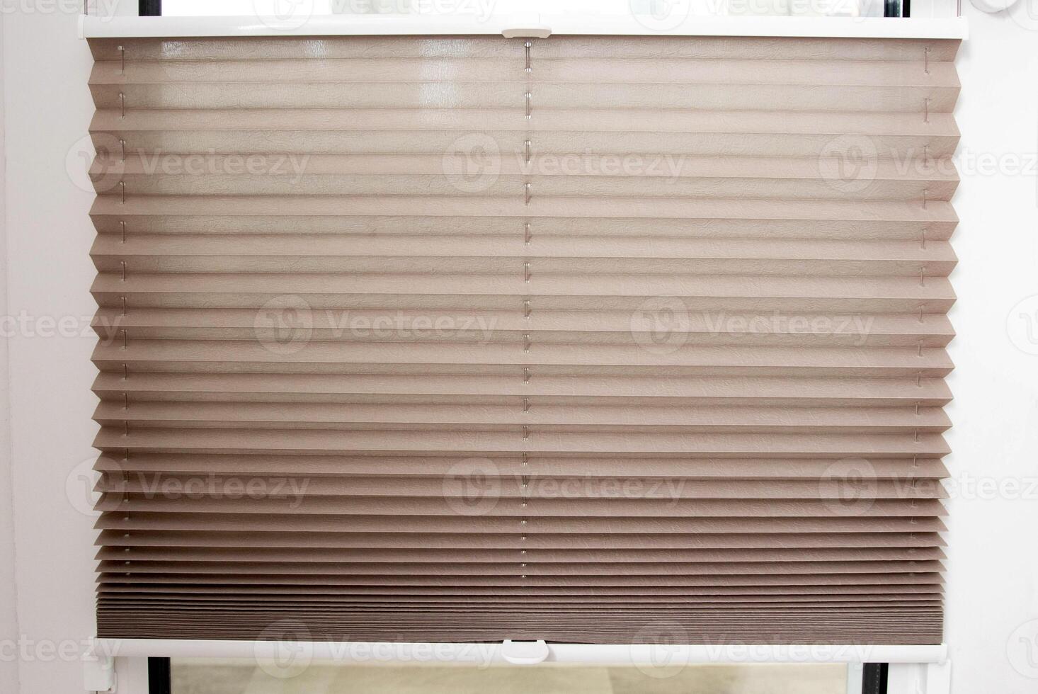 Modern classic aluminum blinds on the window sash with a scaffold fixing system. Protection from prying eyes and the sun. photo