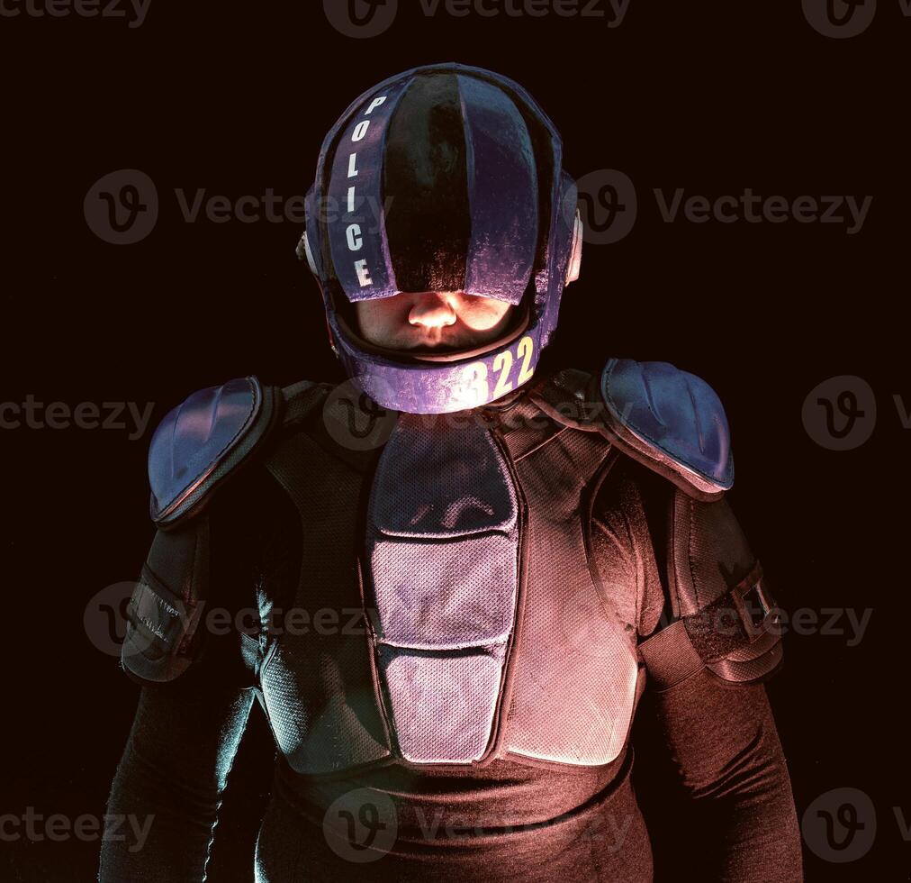 Cyberpunk future concept. Portrait of bionic cyborg police officer in dark. Halfman robot looks at camera. Futuristic science fiction scene, sci. Red blue light blinks. Law, Order photo