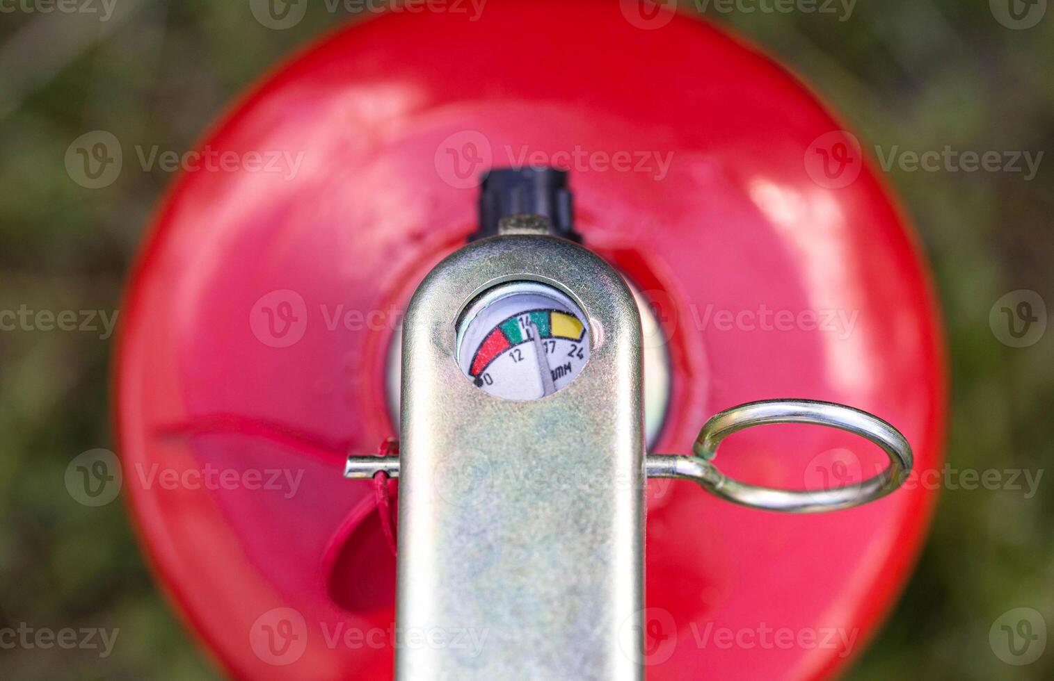 Fire extinguisher manometer close up. Fire extinguisher operating pressure concept, fire preparedness. Shelf life and recharge of fire extinguishers, macro photo