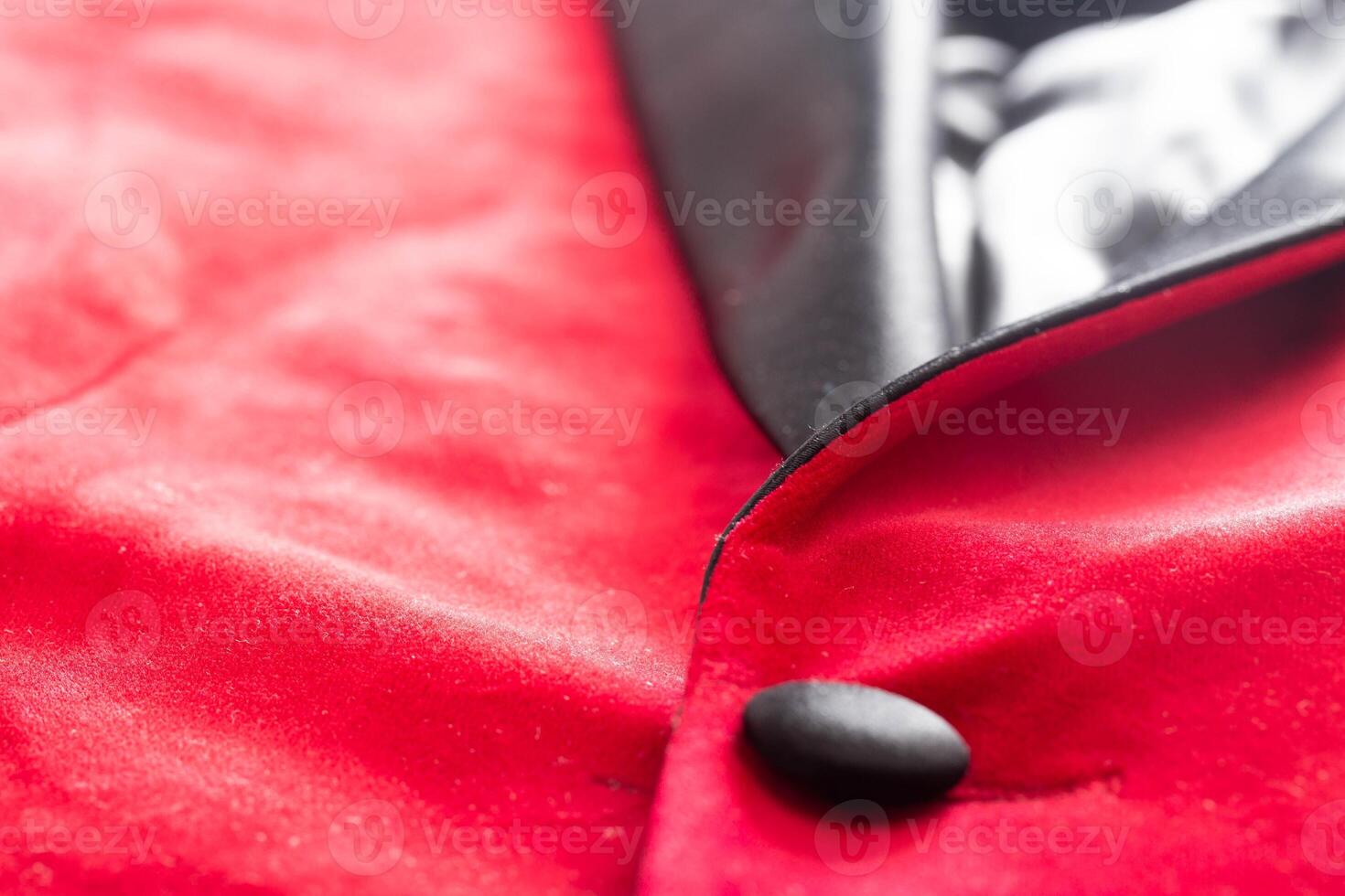 Red stylish jacket with buttons, background. Stylish clothes, macro, elegant photo