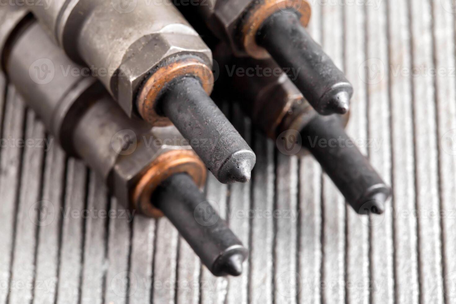 Needles and nozzles on nozzles from a diesel engine. Deterioration of the fuel system of the car, macro photo