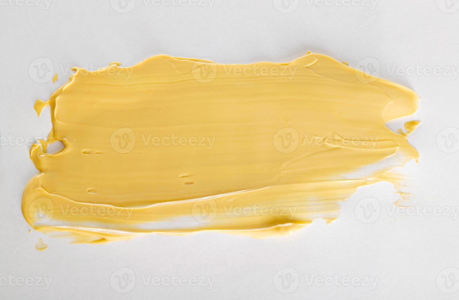 Yellow car polishing paste, close-up. Finishing car body polish. White background, isolate, macro photo