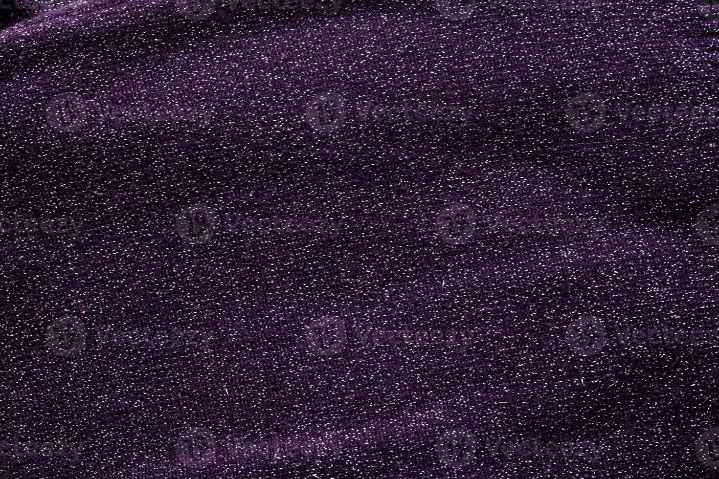 purple sweater with sequins, background, macro. Texture photo