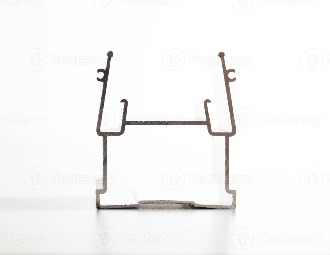 The material is an aluminum profile for the manufacture of windows and suspended ceilings. Close-up photo