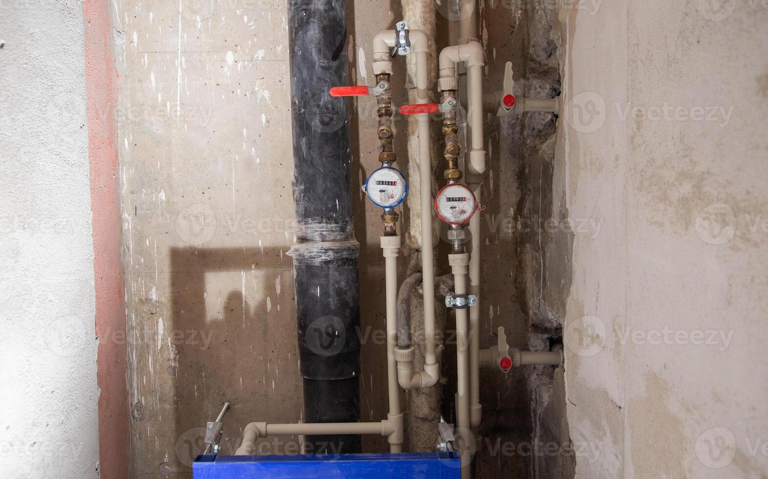 Water meters and polypropylene pipes for cold and hot water. Bypass and taps for heated towel rail. Copy space for text photo