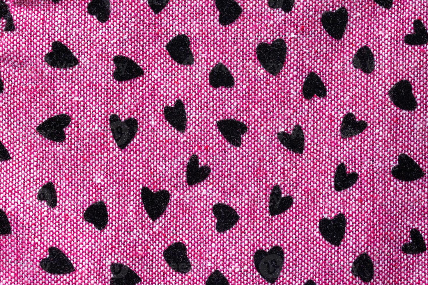 Children's women's dress in hearts of pink color, background, macro. Beautiful photo